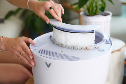 Customer effortlessly removing the washable Nano-Tech filter from the Verta Eco-Friendly Air Purifier.